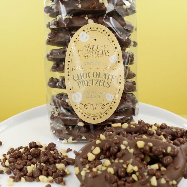 Milk chocolate coated pretzels topped with honeycomb pieces