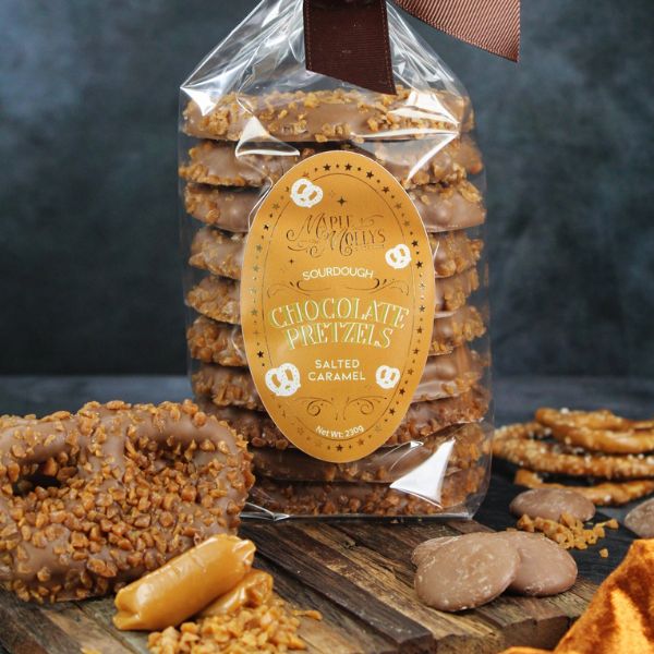 Giant sourdough pretzels coated in chocolate with salted caramel chips