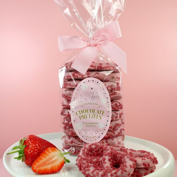 Large gourmet sourdough pretzels coated in chocolate with delicious toppings.