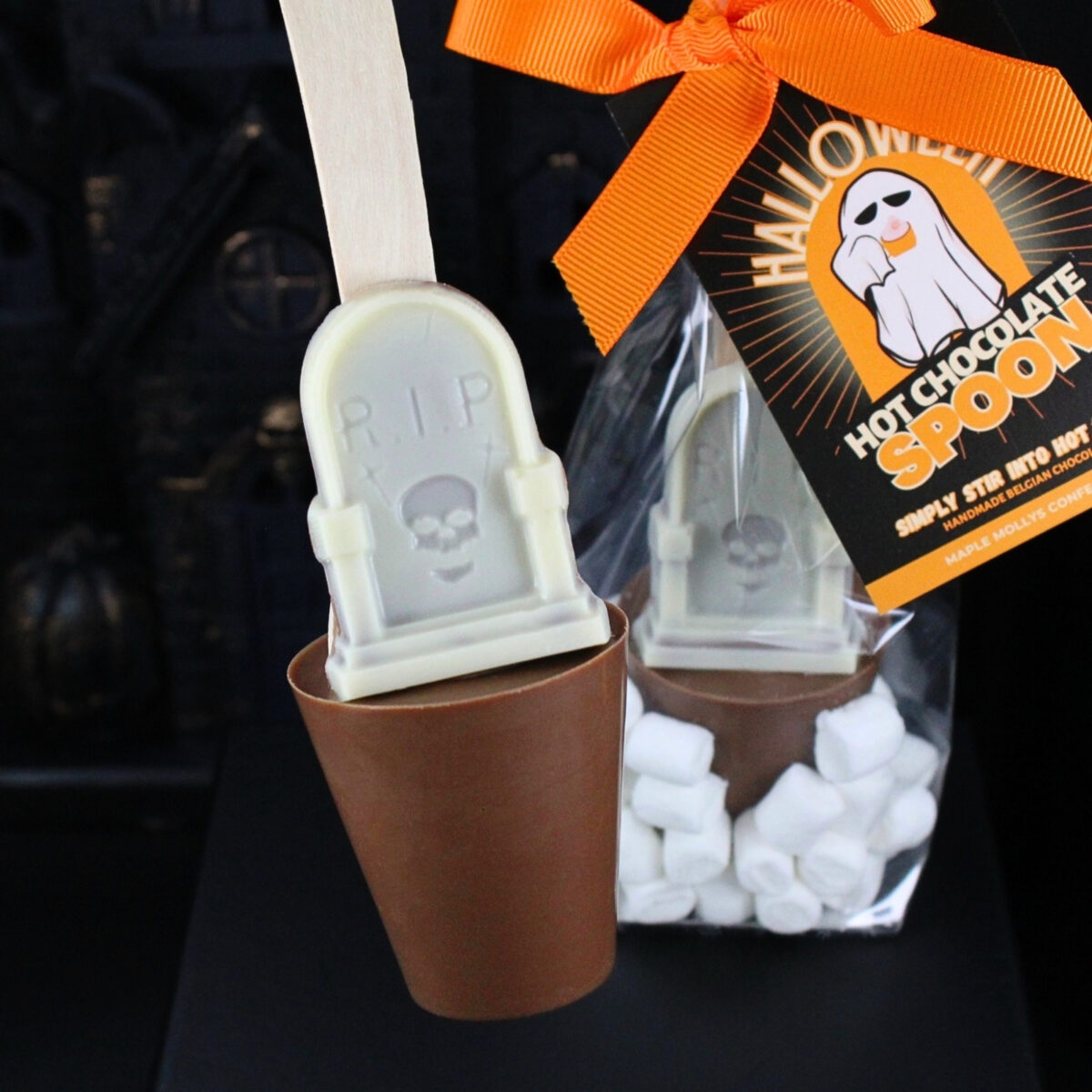 Milk chocolate tombstone hot chocolate spoon with marshmallows, a fun novelty gift or indulgent treat.