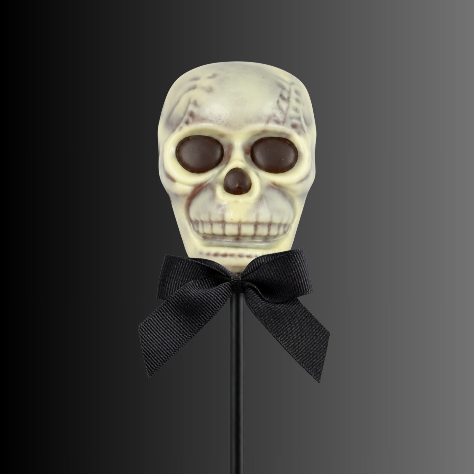 Milk and white chocolate skull shaped lollipop