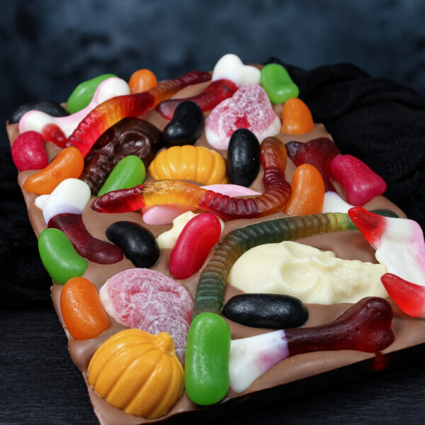 Milk chocolate slab, topped with Halloween themed sweets and chocolate motifs
