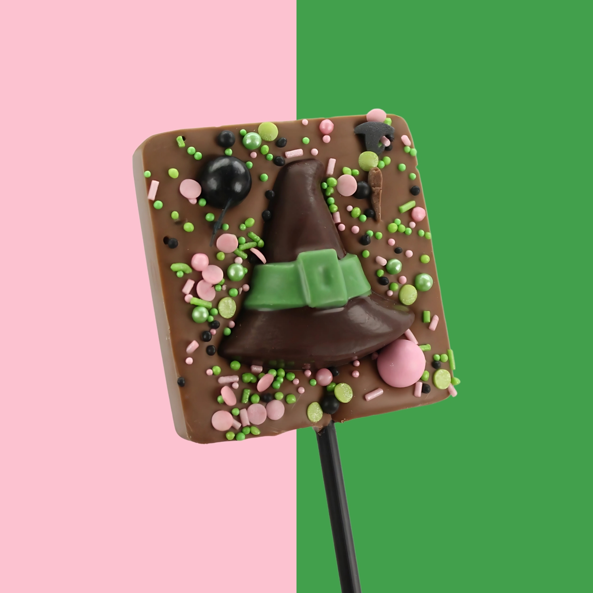 Milk chocolate lollipop topped with a witches hat or pink shoes and sugar sprinkles
